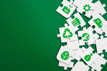 Environmental Puzzle Pieces with Green Icons and Copy Space. jigsaw puzzle pieces with green...