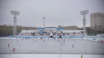 The general plan shows a stadium where a bandy match is taking place between two teams, spotlights sports teams.