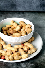 White bowl with peanuts