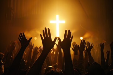 Christian worship service with people raising hands in church singing and praying to God with cross on stage community gathering on Easter or Sunday