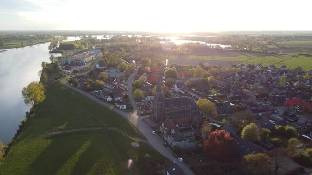 Appeltern, the Netherlands - April 19th 2025: Beautiful aerial footage of the village during the sunset. 
