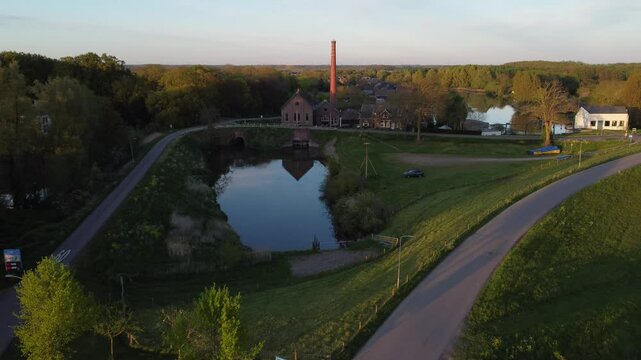 Appeltern, the Netherlands - April 19th 2025: Drone descending towards 'de Tuut' a historic steam pumping station, previously used for water management. 