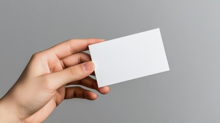 Hand Holding White Business Card in Bright Light Creating Professional Vibe