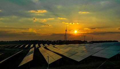 Solar panels and sunset sky. Green energy production in Europe