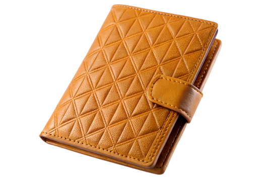 Close up of a tan wallet with a geometric pattern and a strap closure isolated on transparent background