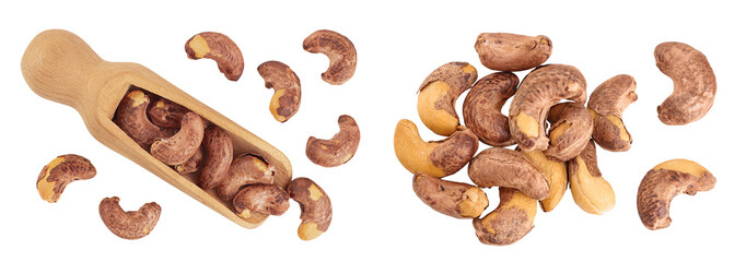 cashew nuts heap with shell in wooden scoop isolated on white background. Top view. Flat lay
