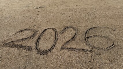 ear 2026 Written in Sand. New Year, Resolution, Holidays, Time Concept, Nature Background, Travel Inspiration, Fresh Start, Calendar & Motivation