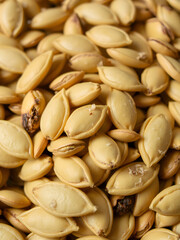 pumpkin seeds with pulp as a background.