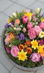 Obraz premium Colorful spring flower arrangement, top view of a floral design element (Bouquet)