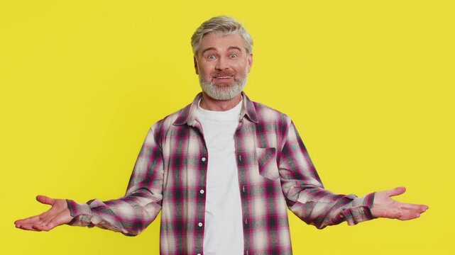 Caucasian middle-aged mature man on yellow background experiencing mind explosion, bright aha moment. Intellectual breakthrough unexpected solution strong brainstorming reaction excited face gesture