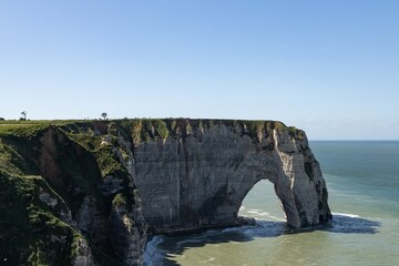 West coast of France. Clifs of Etreta. Rocks on the coast of the English channel strait. Etretat village, Normandy region.