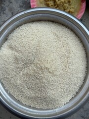 Three isolated bowls on white display the key food ingredients salt, sugar, and a brown powder mix of salt and pepper