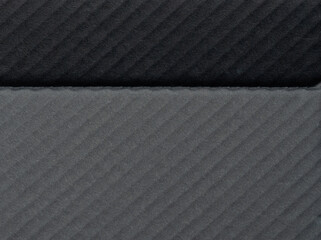 Textured fabric in varying shades of gray with subtle pattern detail
