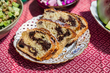 Romanian cozonac sweet bread panettoni, Traditional Easter Dessert with cocoa and walnuts