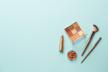 Make up products on blue background.
