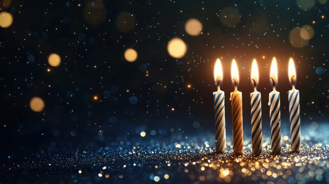 Glowing candles amid sparkling bokeh on festive night