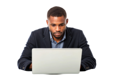 Focused man working on laptop in a professional setting with a serious expression and business attire