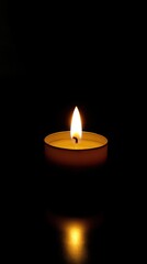 A Single Candle's Flame Illuminates the Darkness, a Symbol of Hope and Remembrance