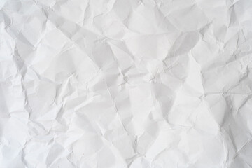 Crumpled white paper texture with creases and folds, perfect for backgrounds, design overlays, scrapbooking, or creative paper-based projects.