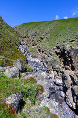 Amazing scenery of the view on stream in the Elbrus region.