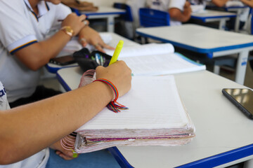 Student at school in the classroom doing activity.