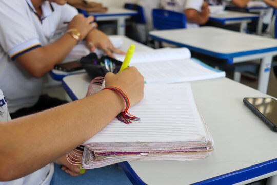 Student at school in the classroom doing activity.