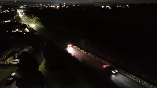 Cars at night on Cullybackey road Ballymena Uk 2024