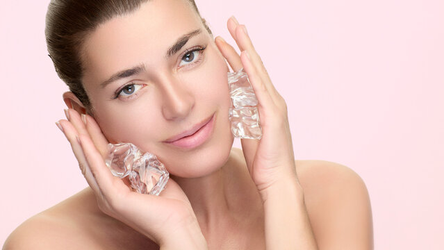 Woman using ice cubes for skincare, promoting beauty and wellness with natural treatments for fresh skin
