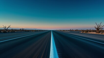Long white dividing line extending into the distance on a deserted highway road