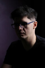 Obraz premium Adult man with facial expressions wearing glasses