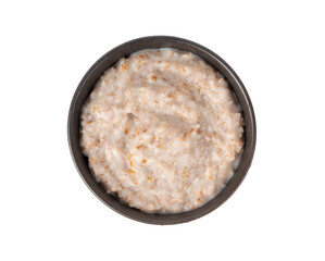 Cooked spelt in bowl. Oatmeal milk porridge, boiled emmer or spelt, healthy cereal food
