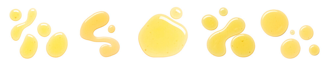 Many drops of honey on white background