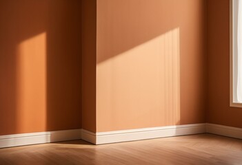 An empty room with a window and a wooden floor.