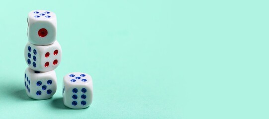 Dices on turquoise background with space for text