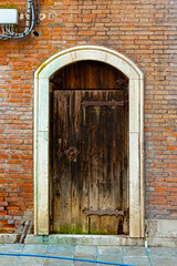 Old brown door brick wall