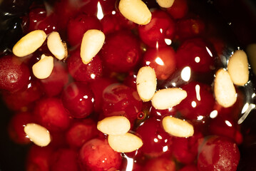Close up of a delicious Altai dessert called NODA, featuring frozen lingonberries and pine nuts...