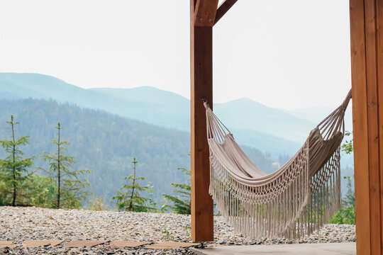 Relaxing in a hammock with stunning mountain views during a peaceful afternoon