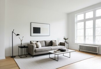 A living room with a gray couch and a white chair.