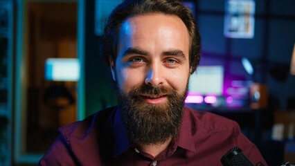 Portrait of ASMR artist uses quality mic in studio to do anti stress video, whispering sounds. Happy man using professional microphone to get sleep inducing high quality audio for meditation, camera B