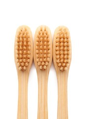Bamboo toothbrushes on white background