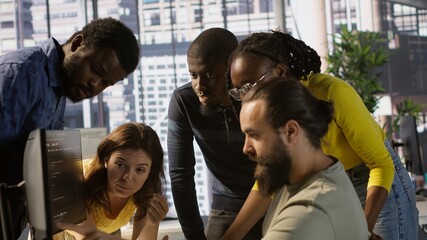 Team of software engineers doing brainstorming to create machine learning models that can process and analyze data to improve decision making processes. Colleagues working together in office, camera A