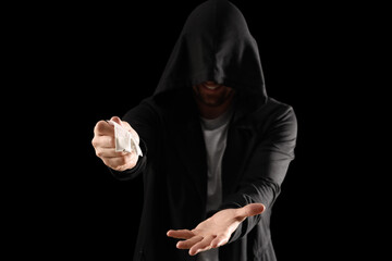 Male junkie with drugs on black background