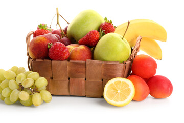 Wicker basket with different fresh fruits on white background