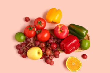 Fruits and vegetables on beige background. Healthy food concept