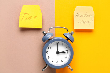Papers with texts TIME, IF NOT NOW WHEN? and alarm clock on colorful background. Time management....