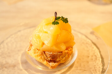 Pineapple choux cake, Puff cake filled with custard cream and pineapple in syrup on top