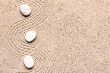 White stones on sand with lines. Zen concept