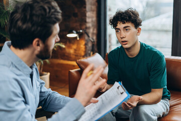 Teenage boy in a psychotherapy session with a psychiatrist