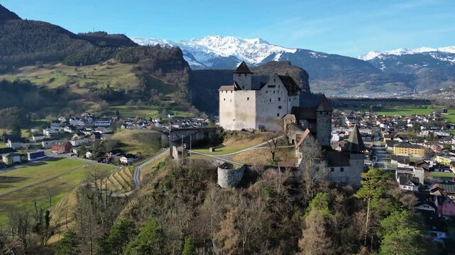 Burg Gutenberg castle in Balzers Liechtenstein with St Nicholas church below