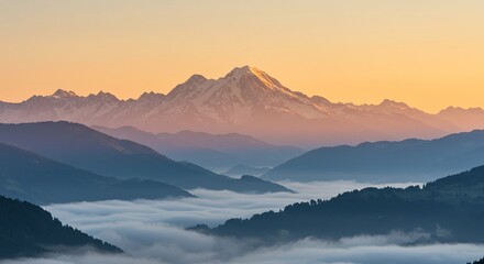 A mountain landscape at dawn, with mist gently covering the valleys and the first rays of sunlight illuminating the snow-covered peaks.